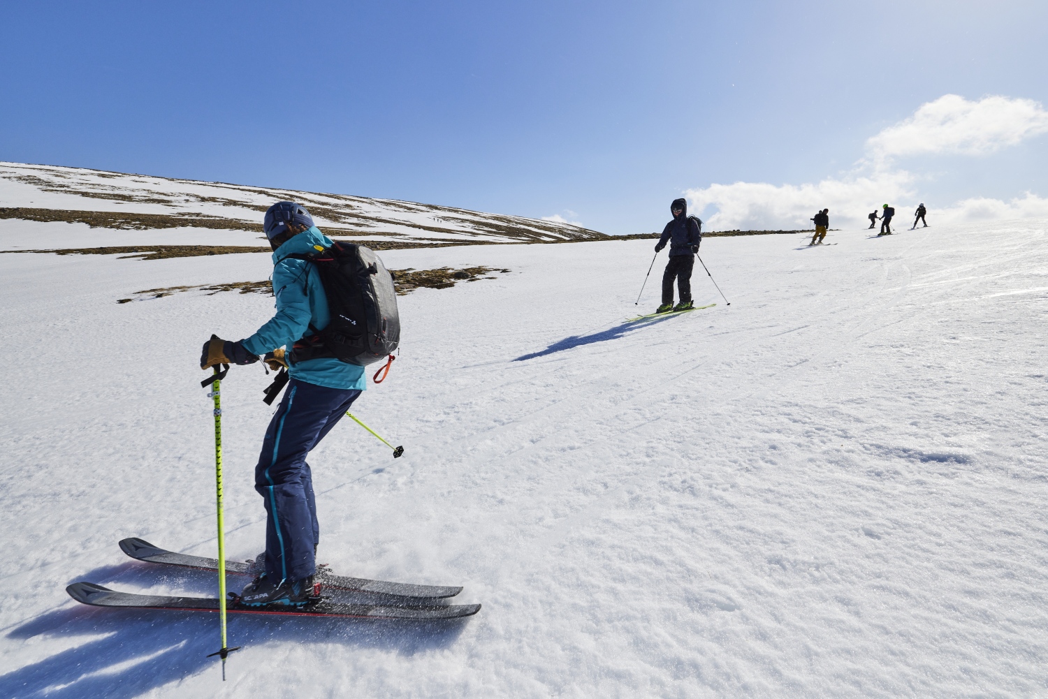 Ski touring across a snowy plain, Scotland