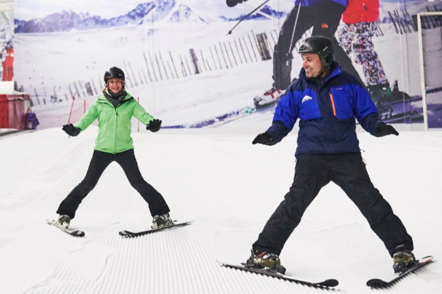 Man teaching woman ski techniques for dry slope skiing - The Snow Centre, Hemel Hempstead