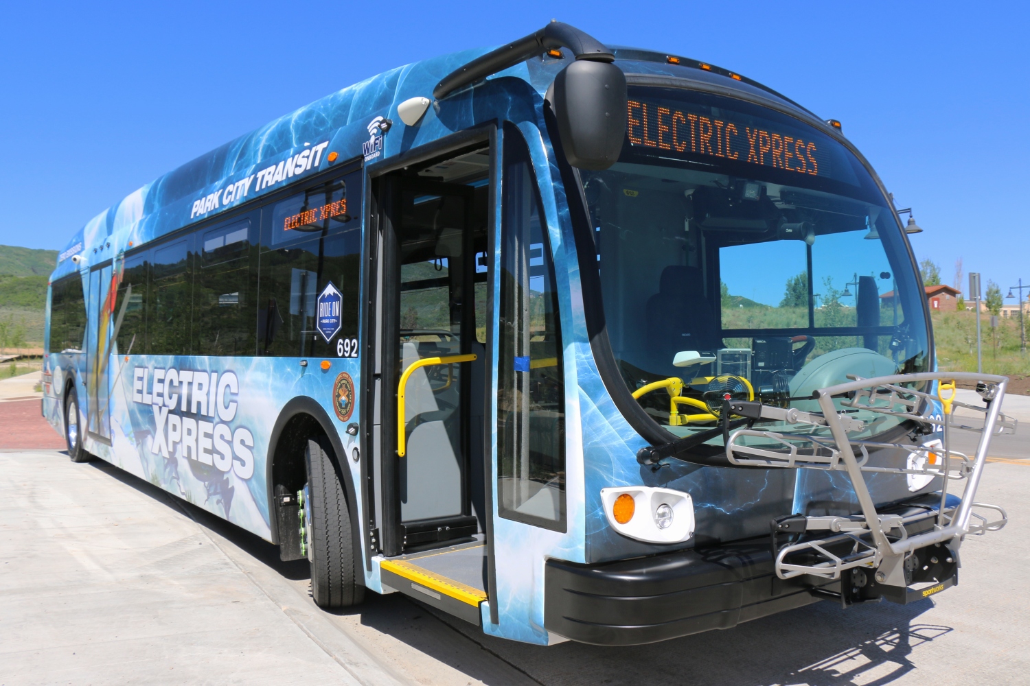 An electric city bus parked with doors open in Park City, UT