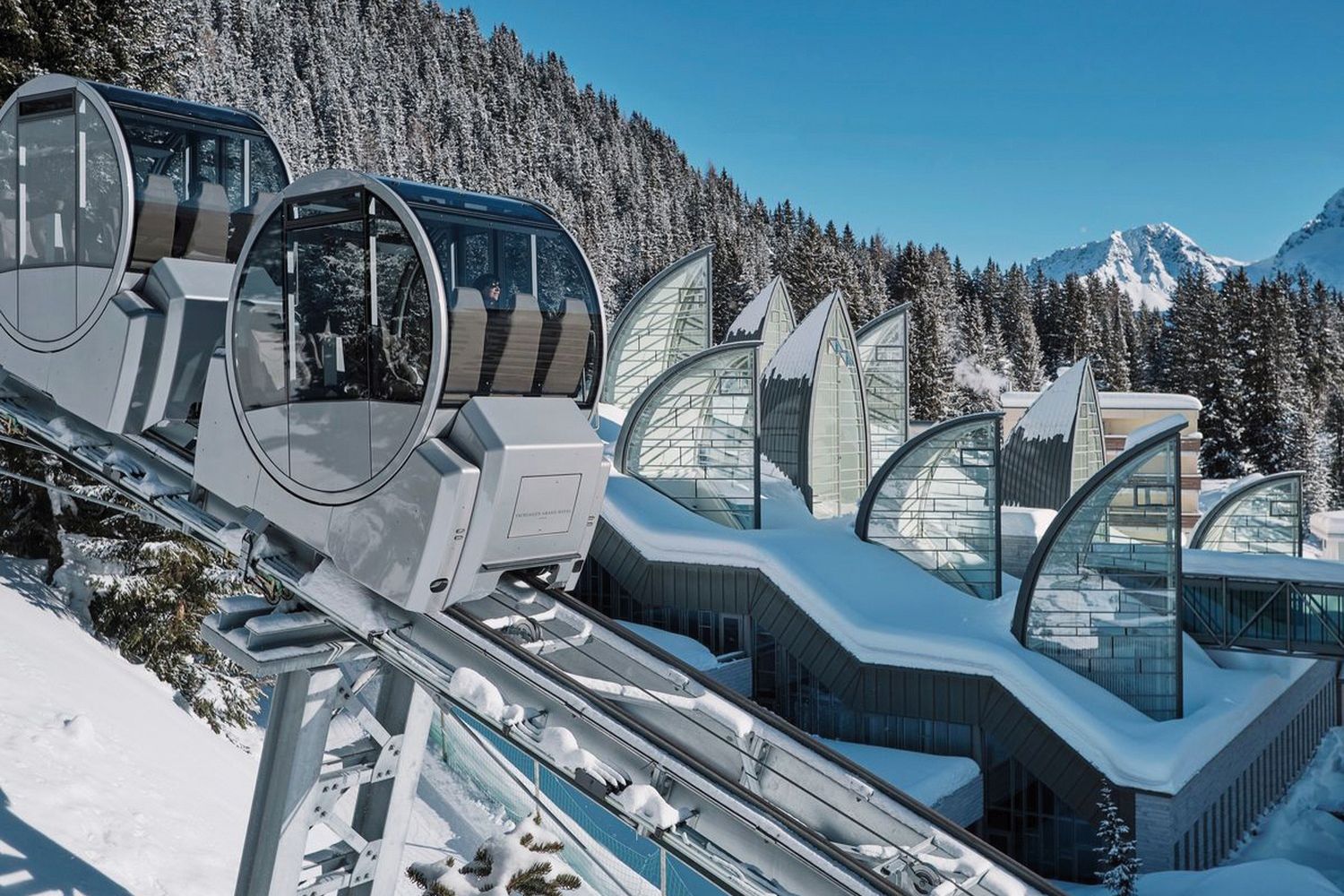 Glass viewing shuttles overlooking snow scene, Arosa, Switzerland