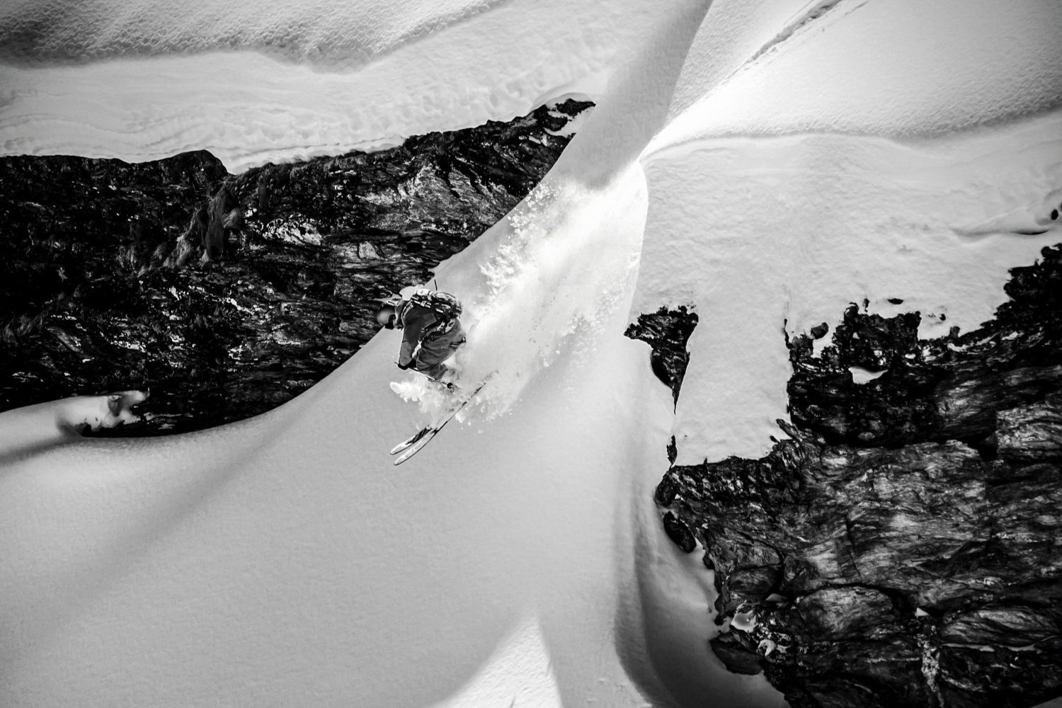 Man skiing down mountain in Verbier