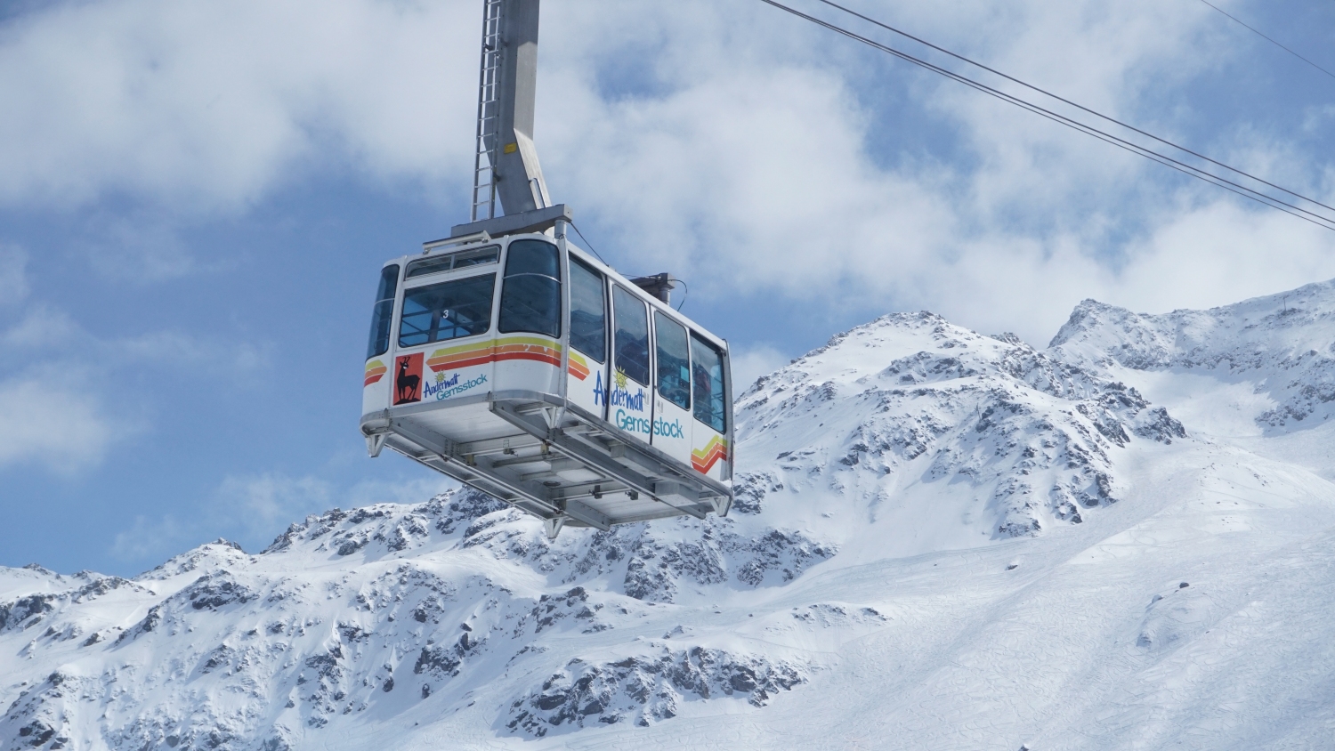 Cable cart with snowy mountain background
