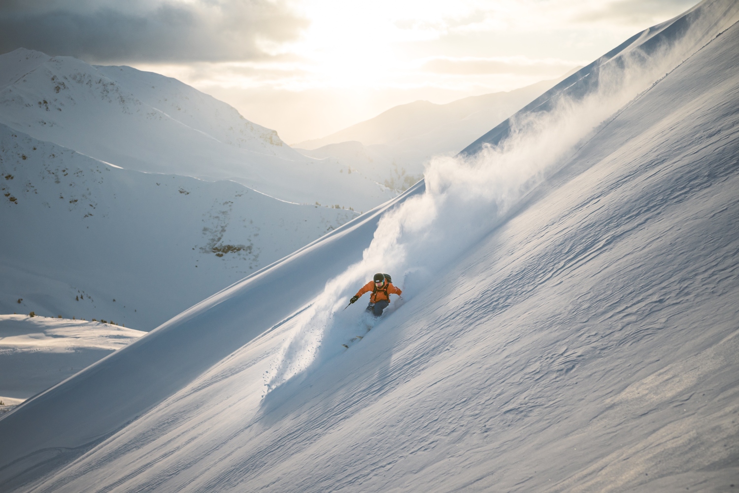 Skiers looking out across snowing mountainscape, Skicircus Saalbach Hinterglemm Leogang Fieberbrunn