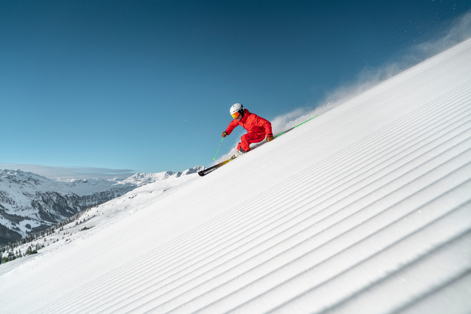 Man skiing down fresh piste