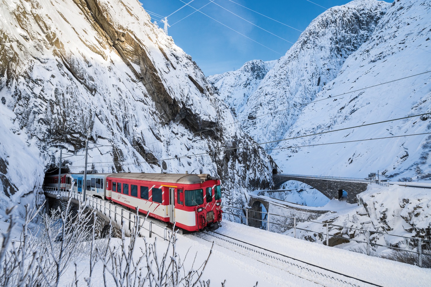 Train coming from snow covered mountain