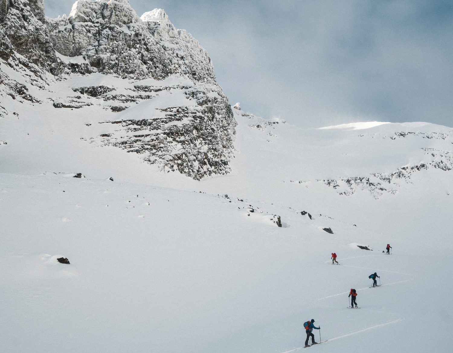 skiers on snowy mountain