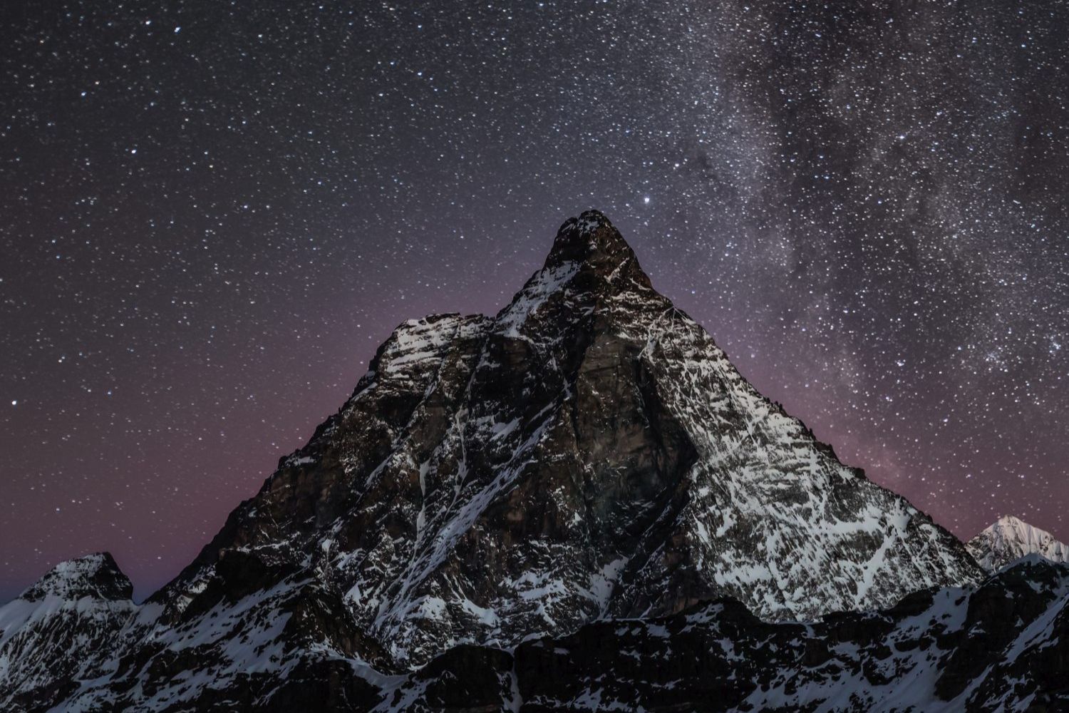 Cluster of stars over the Matterhorn, Italy