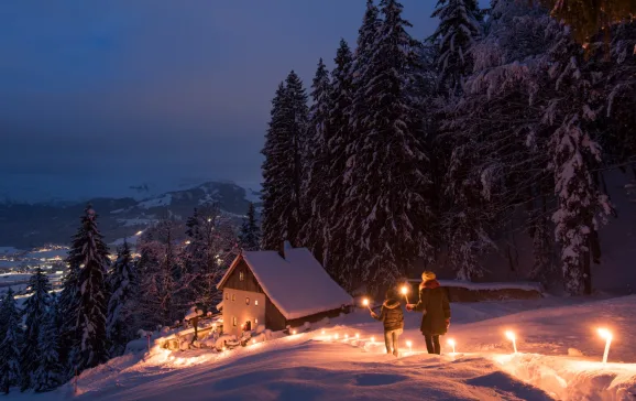 Torchlit winter walk to the Maria Blut hermitage in St. Johann in Tirol CFranz Gerdl
