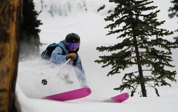 Woman skiing by trees Cabin Fever CREDIT Tom Wilson