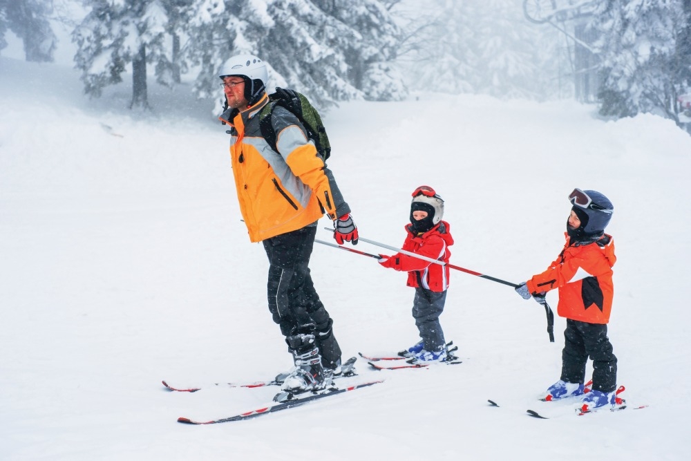 dad pulling kids