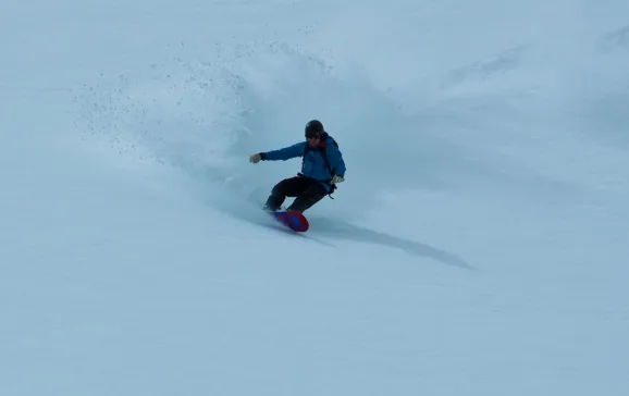 pete coombs making a healside powder turn by mark borland