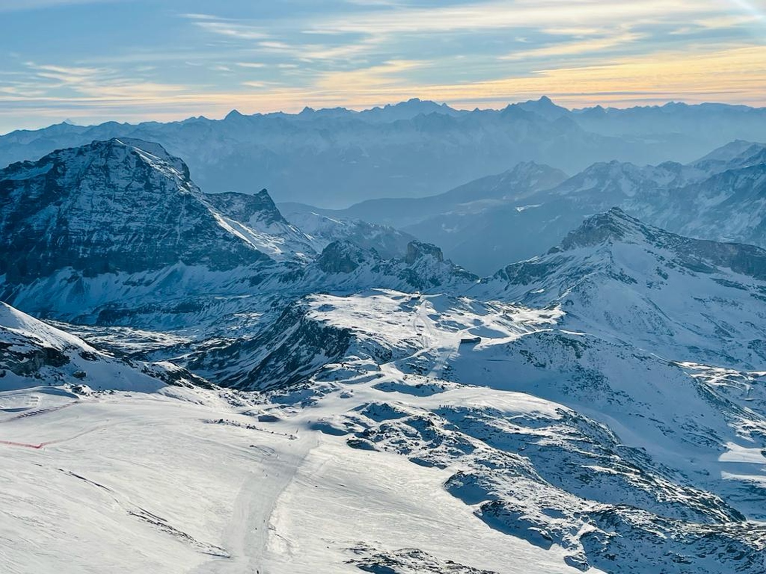 Landscape image of ski slope with mountains in background - Cervinia, Italy