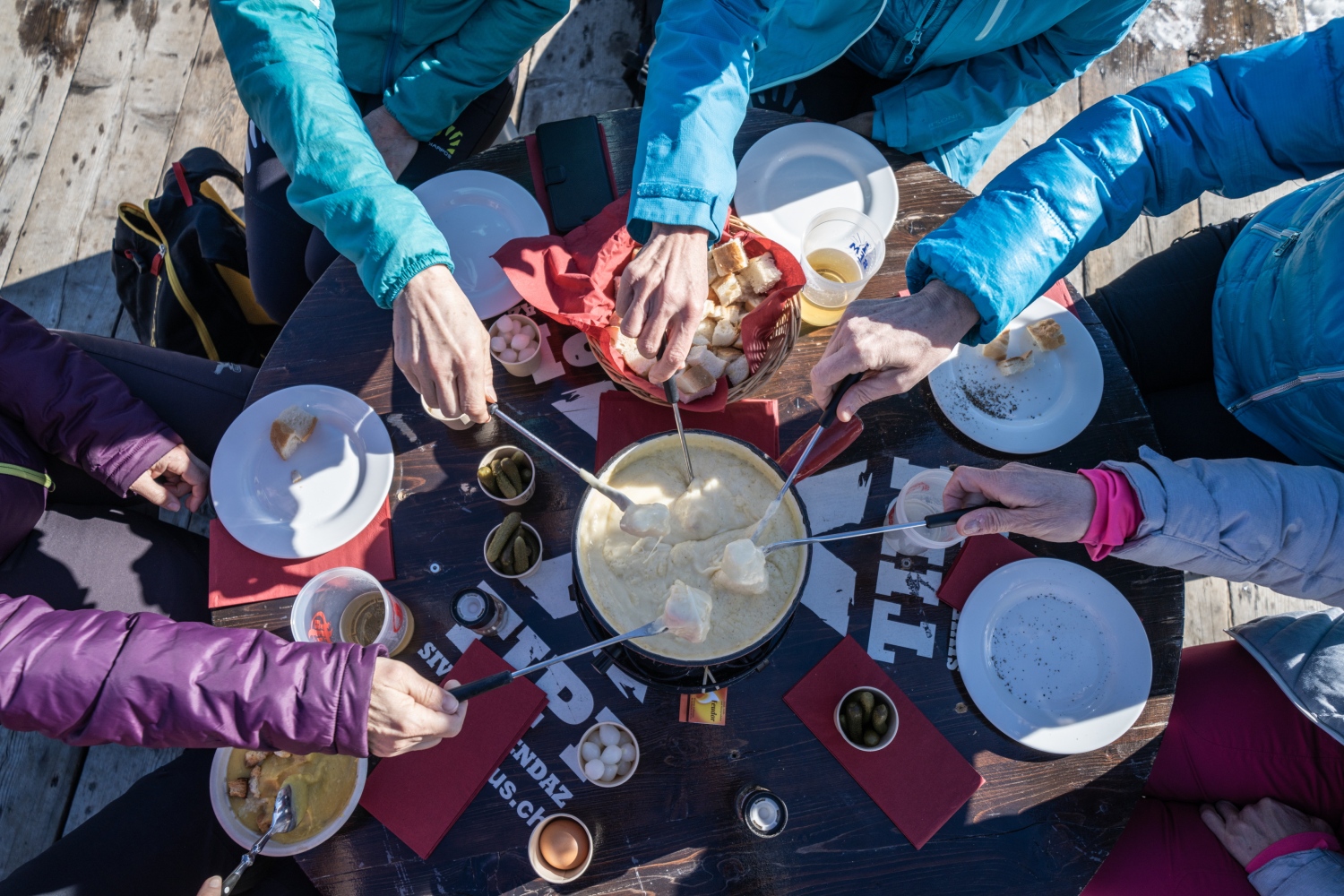 People sharing cheese fondue, Nendaz