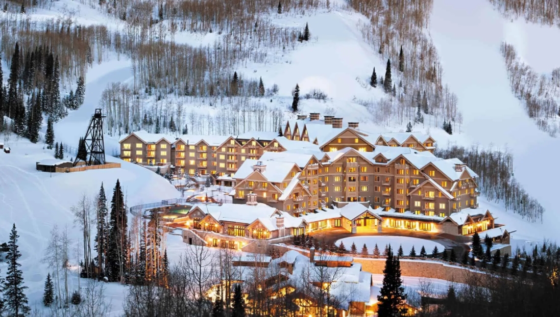 The Montage hotel in Park City at dusk and covered in snow