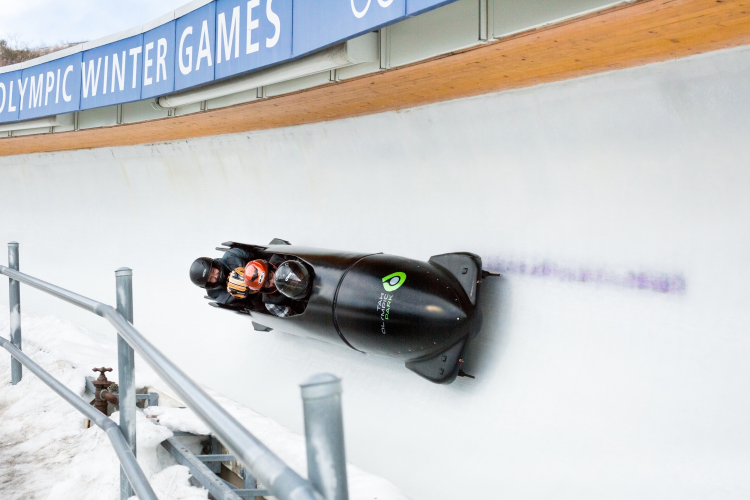 A four-man boblsled rounds a corner on the bobsled and luge track at the Utah Olympic Park in Park City, UT