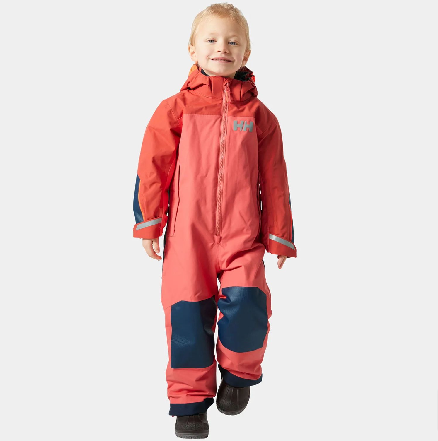 Young boy in red ski playsuit_Helly Hansen